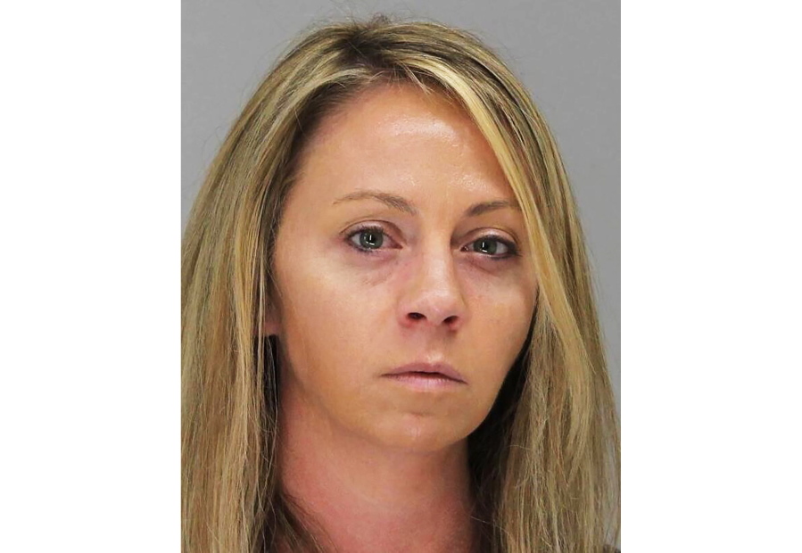 FILE - This October 2019 file booking photo provided by the Dallas County Sheriff's Department shows former Dallas Police Officer Amber Guyger. A Texas court is scheduled to hear arguments Tuesday, April 27, 2021, on overturning the conviction of Guyger, who was sentenced to prison for fatally shooting her neighbor in his home. An attorney for Guyger and prosecutors are set to clash before an appeals court over whether the evidence was sufficient to prove that her 2018 shooting of Botham Jean was murder.