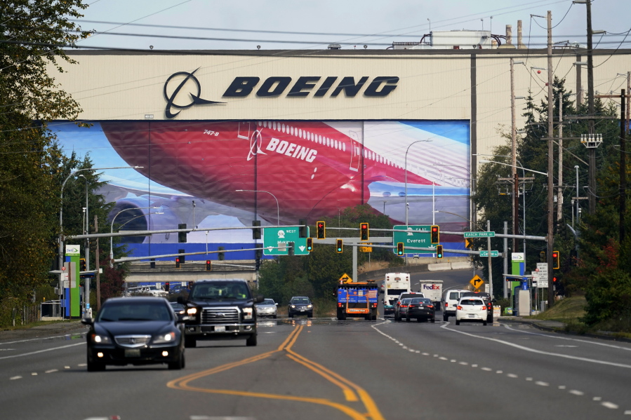 FILE - In this Oct. 1, 2020 file photo, traffic passes the Boeing airplane production plant, in Everett, Wash.  U.S. manufacturers expanded in March 2021 at the fastest pace in 37 years, a sign of strengthening demand as the pandemic wanes and government emergency aid flows through the economy.