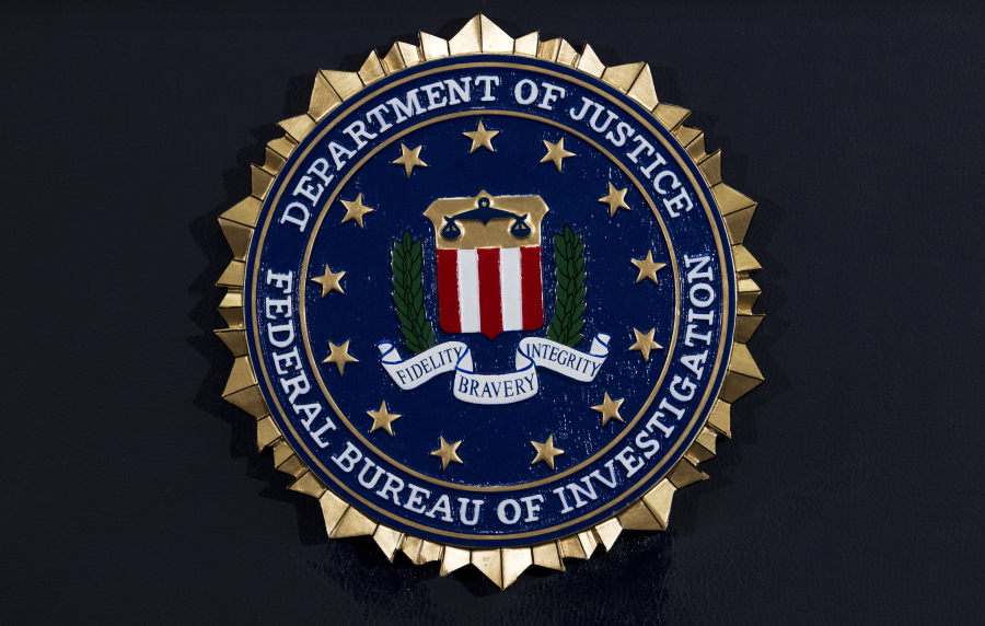 FILE - This Thursday, June 14, 2018, file photo, shows the FBI seal at a news conference at FBI headquarters in Washington. The former top FBI agent in Albany, New York, was a &quot;skilled predator&quot; who harassed eight women in one of the bureau&#039;s most egregious known sexual misconduct cases, according to a federal report obtained by The Associated Press.