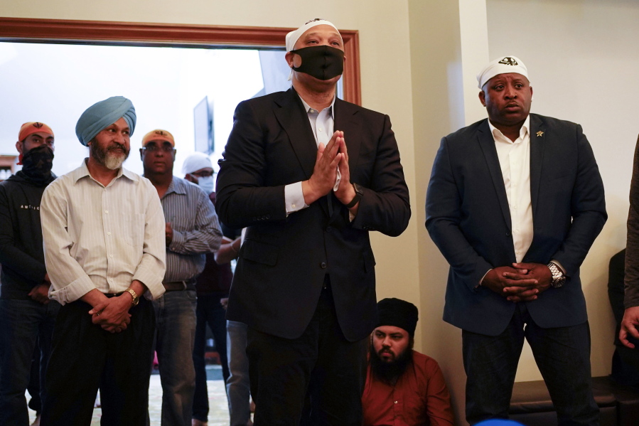 Rep. Andre Carson, D-Ind., speaks with members of the Sikh Coalition at the Sikh Satsang of Indianapolis in Indianapolis, Saturday, April 17, 2021 for a commemoration of the victims of the shooting at a FedEx facility in Indianapolis that claimed the lives of several members of the Sikh community. A gunman killed and wounded several people before taking his own life in a late-night attack at a FedEx facility near the Indianapolis airport.