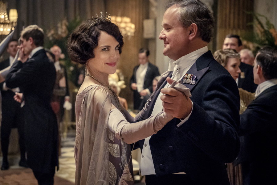 This image released by Focus Features shows Elizabeth McGovern, left, as Lady Grantham and Hugh Bonneville, as Lord Grantham, in "Downton Abbey". The original principal cast of "Downton Abbey" are returning for a second film that will arrive in theaters December 22 this year, Focus Features announced Monday. "Downton Abbey" creator Julian Fellowes has written the screenplay, and Simon Curtis is directing.