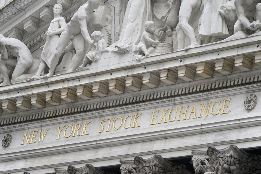 FILE - In this Nov. 23, 2020 file photo, stone sculptures adorn the New York Stock Exchange. Stocks are off to a strong start on Wall Street Monday, April 5, 2021, putting the S&amp;P 500 on track to beat the record high it set last week.