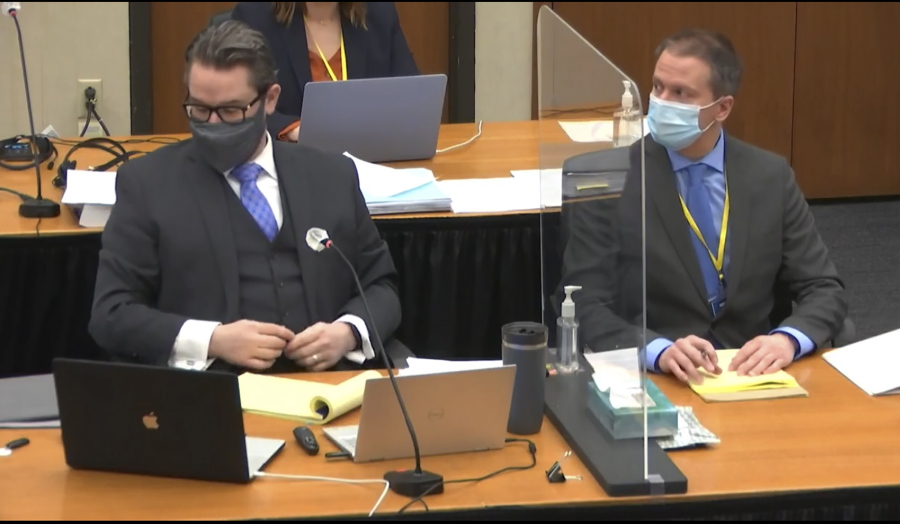 In this image from video, defense attorney Eric Nelson, left, and defendant, former Minneapolis police officer Derek Chauvin, right, listen, Wednesday, April 14, 2021, as Hennepin County Judge Peter Cahill presides over motions in the trial of Chauvin at the Hennepin County Courthouse in Minneapolis. Chauvin is charged in the May 25, 2020 death of George Floyd.