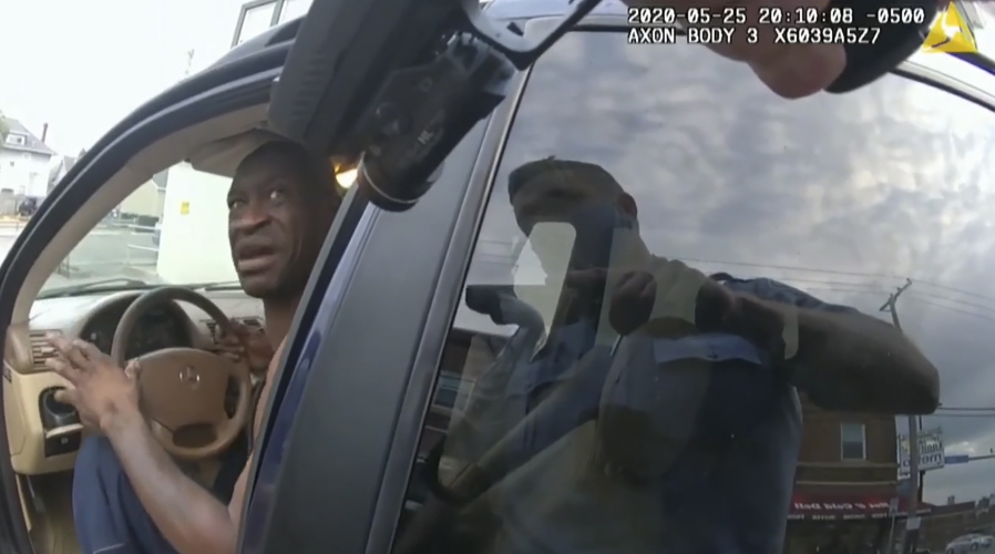 In this image from police body cam video, a Minneapolis police officer approaches George Floyd with a gun drawn, on May 25, 2020, outside Cup Foods in Minneapolis, as it is shown Wednesday, March 31, 2021, in the trial of former Minneapolis police Officer Derek Chauvin, in Floyd&#039;s death, at the Hennepin County Courthouse in Minneapolis.