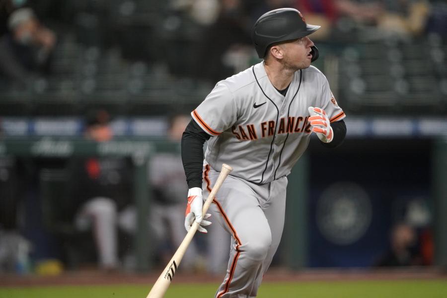 San Francisco Giants&#039; Buster Posey watches his solo home run during the third inning of the team&#039;s baseball game against the Seattle Mariners, Friday, April 2, 2021, in Seattle. (AP Photo/Ted S.
