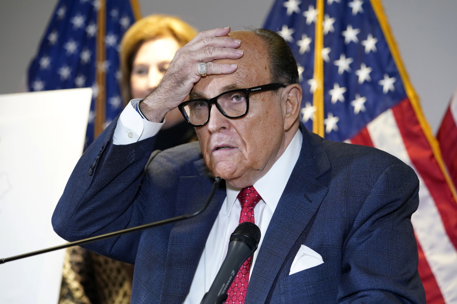FILE - In this Nov. 19, 2020, file photo, former New York Mayor Rudy Giuliani, who was a lawyer for President Donald Trump, speaks during a news conference at the Republican National Committee headquarters in Washington. A law enforcement official tells the Associated Press that federal investigators have executed a search warrant at Rudy Giuliani's Manhattan residence. The former New York City mayor has been under investigation for several years over his business dealings in Ukraine.