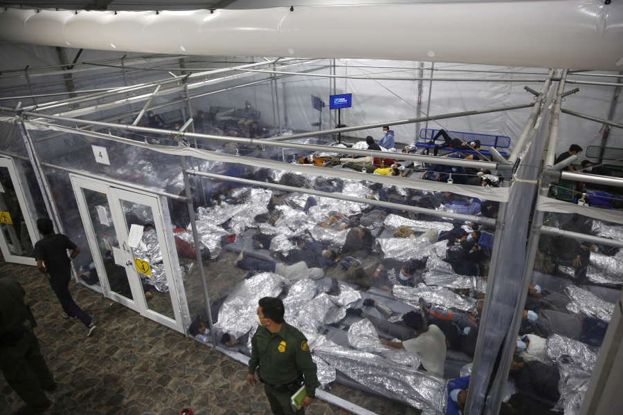 FILE - In this March 30, 2021, file photo, young minors lie inside a pod at the Donna Department of Homeland Security holding facility, the main detention center for unaccompanied children in the Rio Grande Valley run by U.S. Customs and Border Protection (CBP), in Donna, Texas. U.S. authorities say they picked up nearly 19,000 children traveling alone across the Mexican border in March. It&#039;s the largest monthly number ever recorded and a major test for President Joe Biden as he reverses many of his predecessor&#039;s hardline immigration tactics.