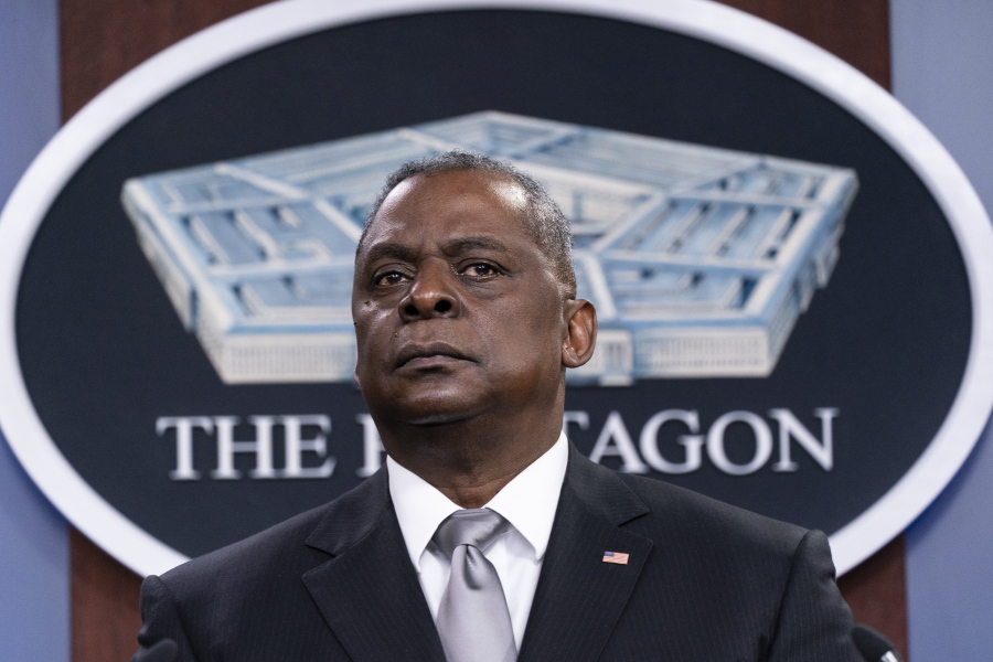 FILE - Secretary of Defense Lloyd Austin listens to a question as he speaks during a media briefing at the Pentagon in Washington, in this Friday, Feb. 19, 2021, file photo. U.S. Defense Secretary Lloyd Austin met Sunday, April 11, 2021, in Tel Aviv with his Israeli counterpart and reinforced American support.