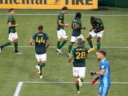 Portland Timbers celebrate a goal by Dairon Asprilla (27) during an MLS soccer match against the Houston Dynamo on Saturday, April 24, 2021, in Portland, Ore.