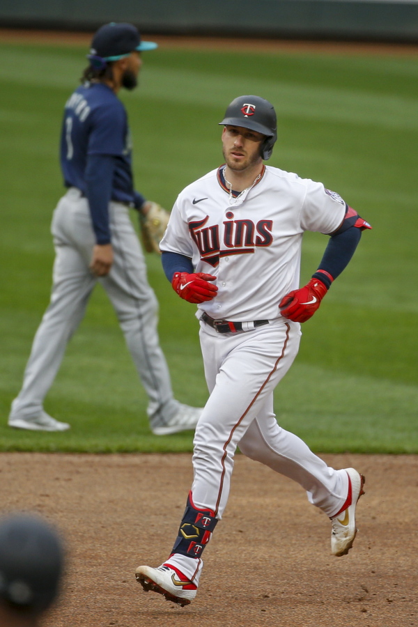 Minnesota Twins&#039; Mitch Garver runs the bases after hitting a three run home run against the Seattle Mariners in the third inning of a baseball game Thursday, April 8, 2021, in Minneapolis.