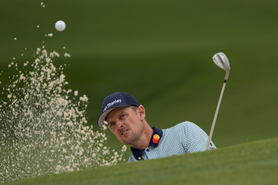 Justin Rose, of England, hits out of a bunker on the seventh hole during the second round of the Masters golf tournament on Friday, April 9, 2021, in Augusta, Ga.