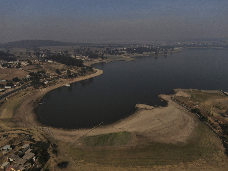 An aerial view of Villa Victoria Dam, the main water supply for Mexico City residents, on the outskirts of Toluca, Mexico Thursday, April 22, 2021. Drought conditions now cover 85% of Mexico, and in areas around Mexico City and Michoac'an, the problem has gotten so bad that lakes and reservoirs are drying up.