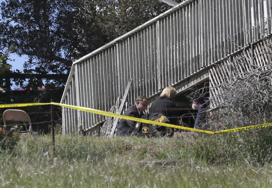 San Luis Obispo Sheriff&#039;s Office personnel dig in an area in the backyard of the home of Ruben Flores, Tuesday, March 16, 2021, in Arroyo Grande, Calif. Flores is the father of Paul Flores, who remains the prime suspect in the disappearance of Kristin Smart in 1996.