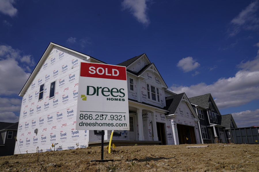 FILE - In this Sept. 25, 2020 file photo, a "sold" sign sits on a lot as new home construction continues in Westfield, Ind. Mortgage rates fell for the first time in more than two months as buyers continue to be stifled by high prices and limited supply.