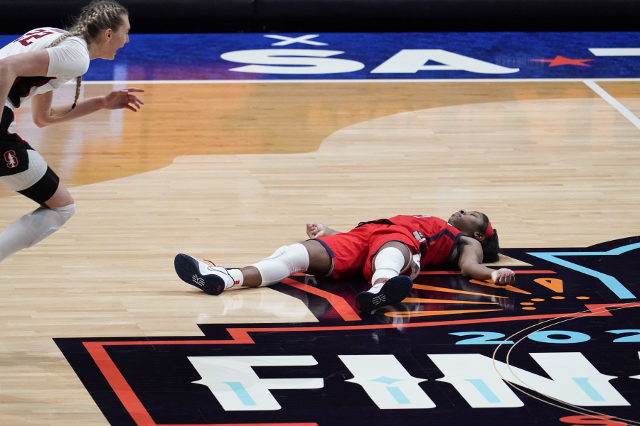 Arizona guard Aari McDonald lies on the court after missing a shot at the end of the championship game against Stanford in the women&#039;s Final Four NCAA college basketball tournament, Sunday, April 4, 2021, at the Alamodome in San Antonio. Stanford won 54-53.
