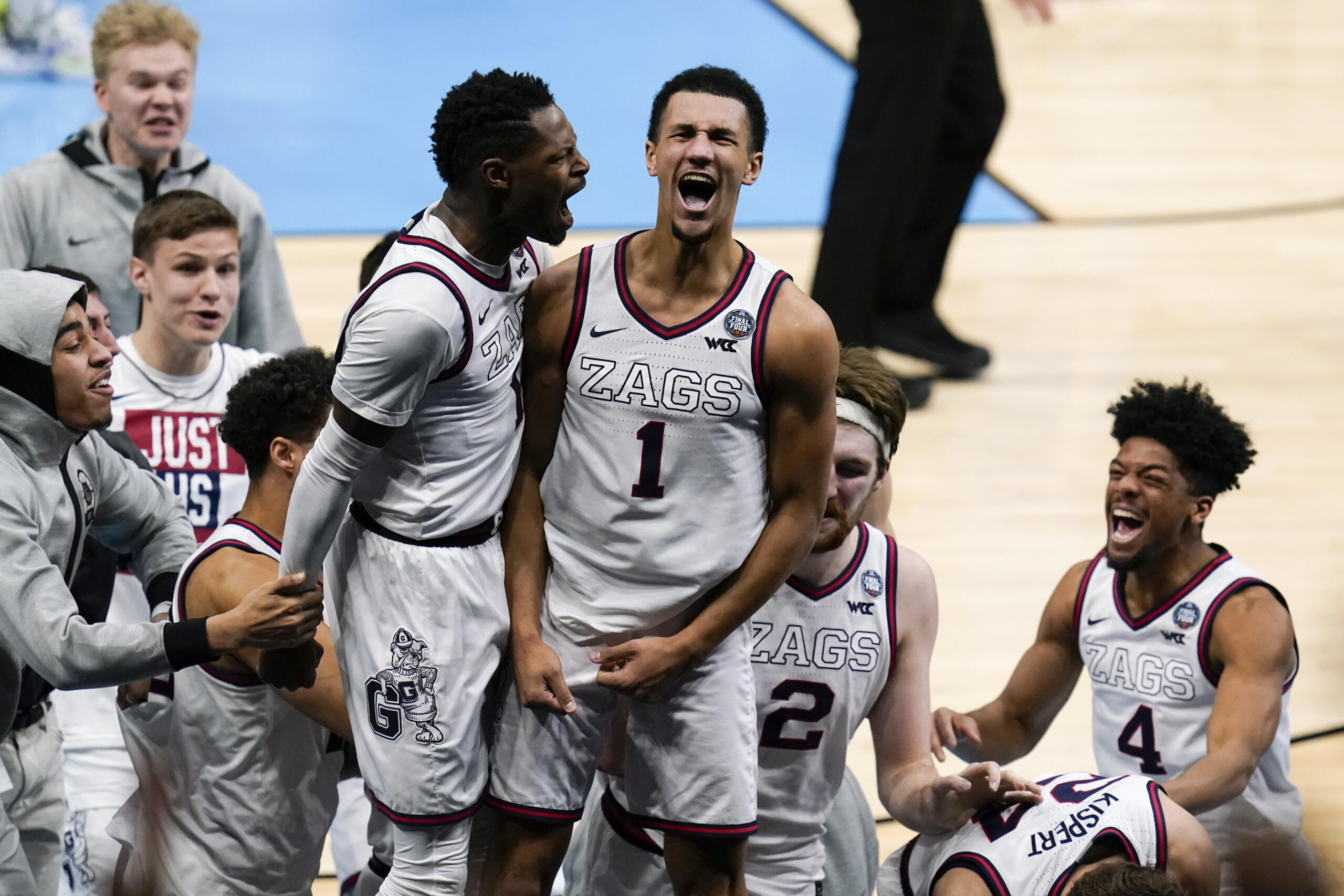 Gonzaga guard Jalen Suggs (1) celebrates making the game winning basket with Joel Ayayi, left, against UCLA during overtime in a men's Final Four NCAA college basketball tournament semifinal game, Saturday, April 3, 2021, at Lucas Oil Stadium in Indianapolis. Gonzaga won 93-90.