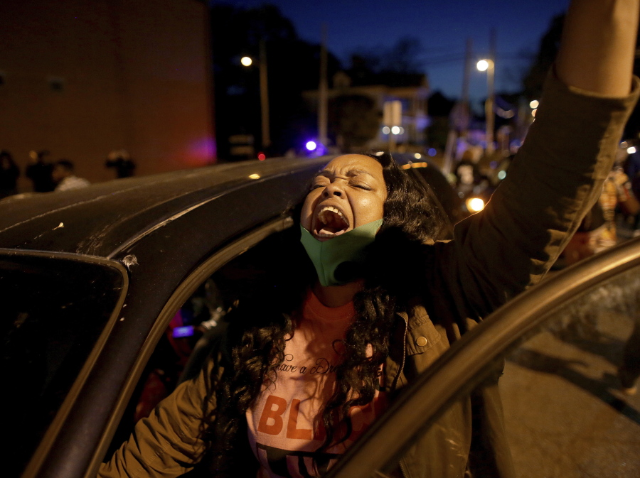 A demonstrator yells from her car as protesters took to the streets in Elizabeth City, N.C., on Monday, April 26, 2021, to protest the killing of Andrew Brown by police and to demand the full body camera footage be released. (Stephen M.