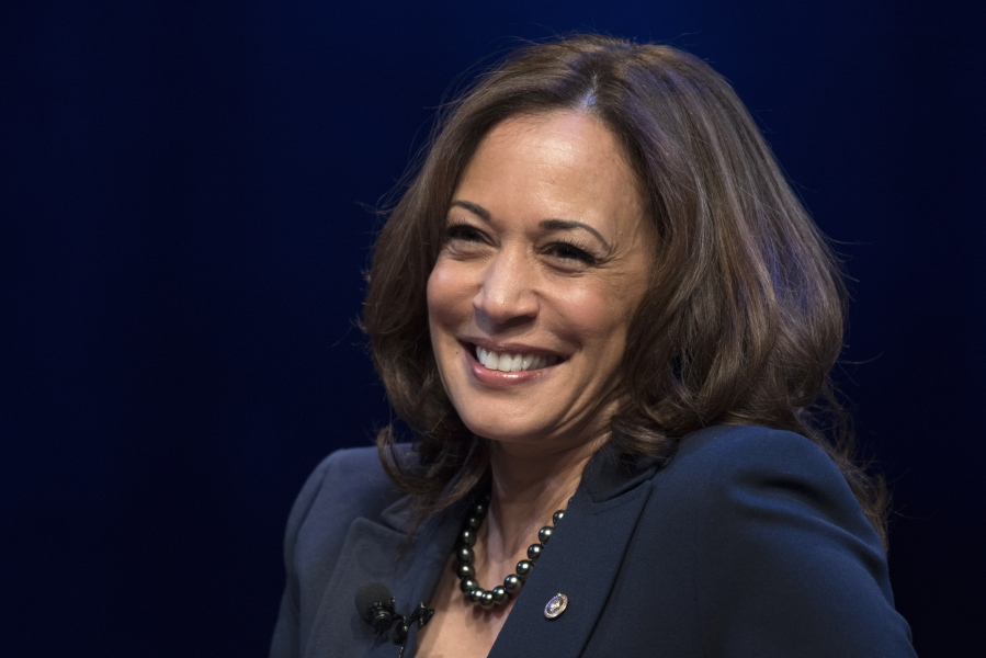 FILE - In this Jan. 9, 2019, file photo, kicking off her book tour, Sen. Kamala Harris, D-Calif., speaks at George Washington University in Washington. On Friday, April 30, 2021, The Associated Press reported on stories circulating online incorrectly asserting that a copy of Harris' children's book, "Superheroes Are Everywhere,"  is being given to every migrant child in a Long Beach, Calif., facility housing unaccompanied minors who recently arrived at the border.