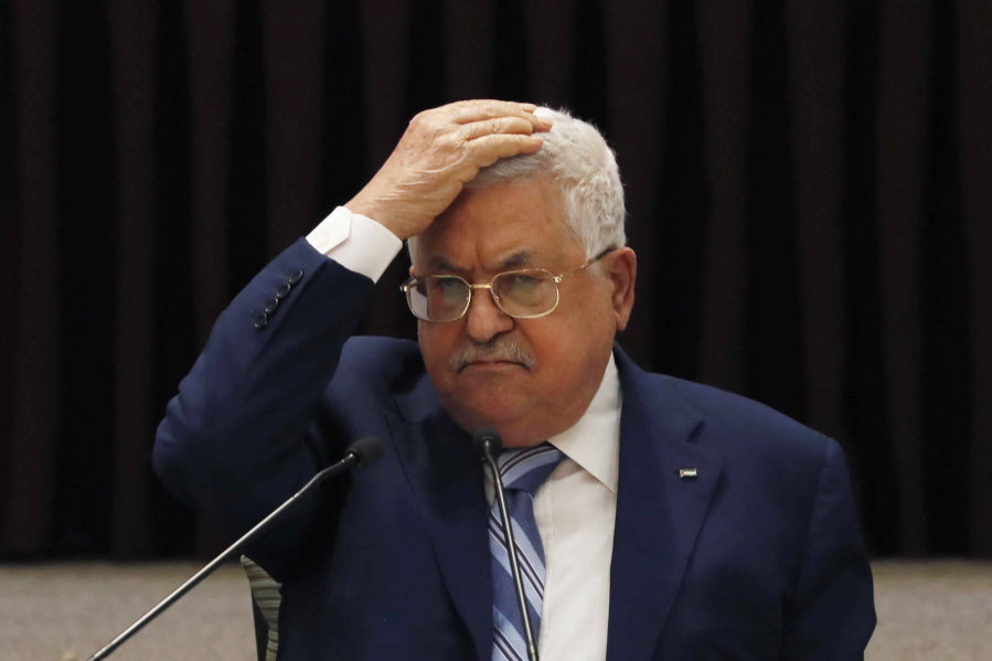FILE - In this Aug. 18, 2020 file photo, Palestinian President Mahmoud Abbas gestures during a meeting with the Palestinian leadership, in the West Bank city of Ramallah. Egyptian officials said late monday, April 26, 2021, that the Palestinian Authority plans to call off its first elections in 15 years, citing Israel's refusal to allow voting in east Jerusalem. The decision would effectively grant Israel a veto over the holding of elections, though Abbas could also benefit from the canceling a vote in which his fractured Fatah party is expected to lose power and influence to the Islamic militant group Hamas.