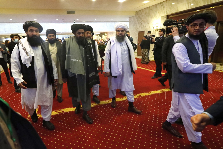 FLE - In this March 18, 2021, file photo, Taliban co-founder Mullah Abdul Ghani Baradar, center, arrives with other members of the Taliban delegation for attending an international peace conference in Moscow, Russia.