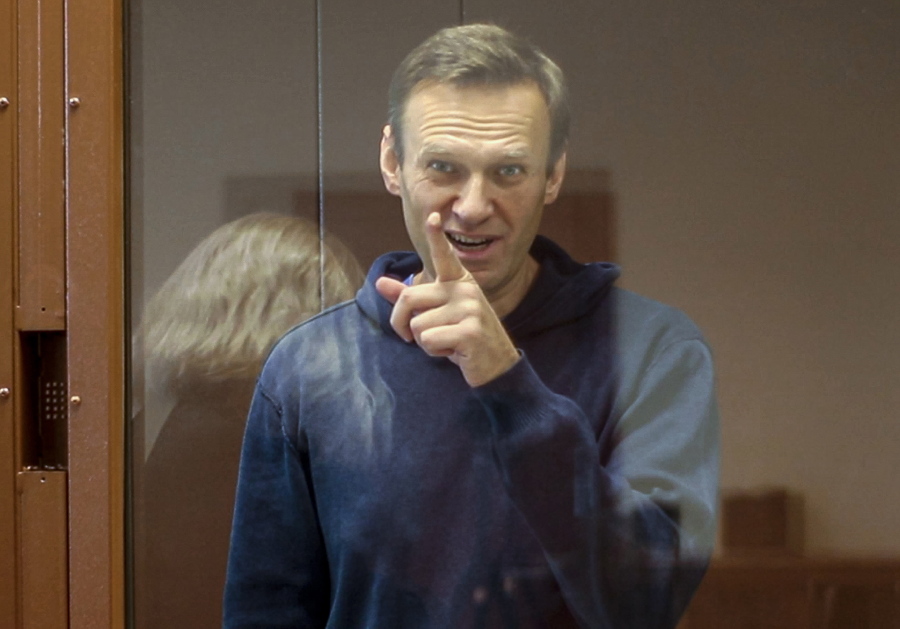 FILE - In this Feb. 16, 2021, file photo taken from footage provided by the Babuskinsky District Court, Russian opposition leader Alexei Navalny gestures during a court hearing in Moscow, Russia. Several doctors were prevented Tuesday, April 20, from seeing Navalny in a prison hospital after his three-week hunger strike, and prosecutors also detailed a sweeping, new case against his organization.