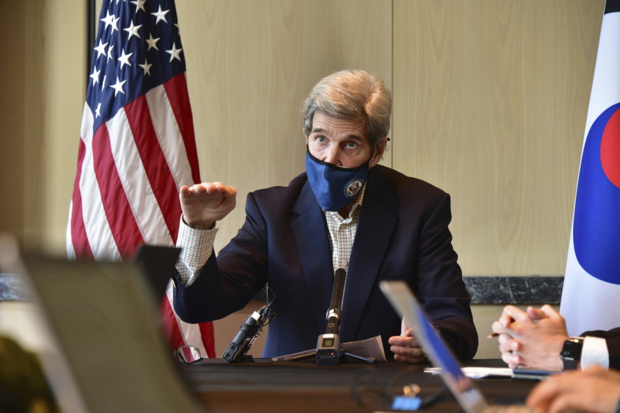 In this photo provided by U.S. Embassy Seoul, U.S. special envoy for climate John Kerry gestures while  speaking during a round table meeting with the media in Seoul, South Korea, Sunday, April 18, 2021.  (U.S.