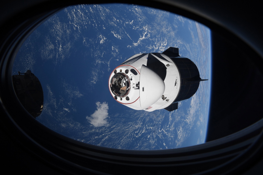 In this Saturday, April 24, 2021 photo made available by NASA, the SpaceX Crew Dragon capsule approaches the International Space Station for docking. SpaceX's four astronauts had barely settled into orbit on Friday, April 23, when they were ordered back into their spacesuits because of a potential collision with orbiting junk. It turns out there was no threat, the U.S. Space Command acknowledged Monday, April 26. The error is under review.