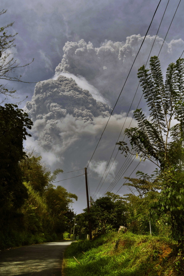Plumes of ash rise Friday from the La Soufriere volcano as it erupts on the eastern Caribbean island of St. Vincent.