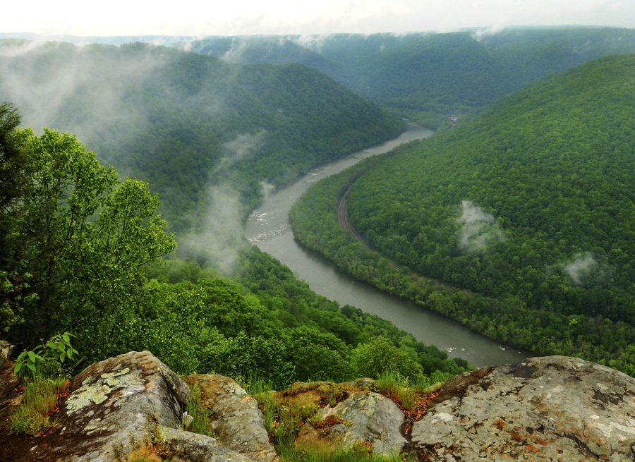 FILE - This May 9, 2012, file photo, shows the Grandview State Park overlooking the New River Gorge National River in Grandview, W.Va. The state offers numerous trails for hiking and other spots with scenic views. With West Virginia poised to lose another congressional seat due to its long, steady population decline, Republican lawmakers are convinced a massive tax cut is the key to reversing the trend.