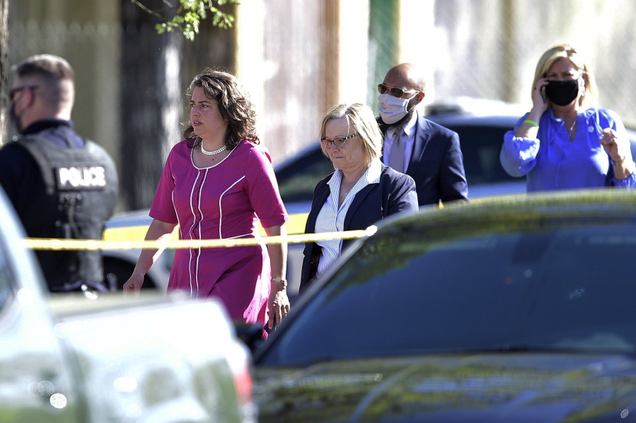 Knoxville Mayor Indya Kincannon, left, arrives at the scene of a shooting at Austin-East High School in Knoxville, Tenn. on Monday, April 12, 2021.