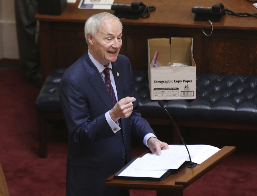 FILE - In this April 8, 2020 photo, Arkansas Gov. Asa Hutchinson gives the State of the State in the senate chamber of the state Capitol in Little Rock, Ark. Hutchinson vetoed legislation that would have made his state the first to ban gender confirming treatments for transgender youth.