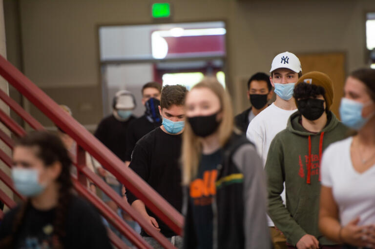 A class walks through a common area at Camas High School on Monday, April 19, 2021. Camas returned to four-day-a-week in-person instruction on Monday.