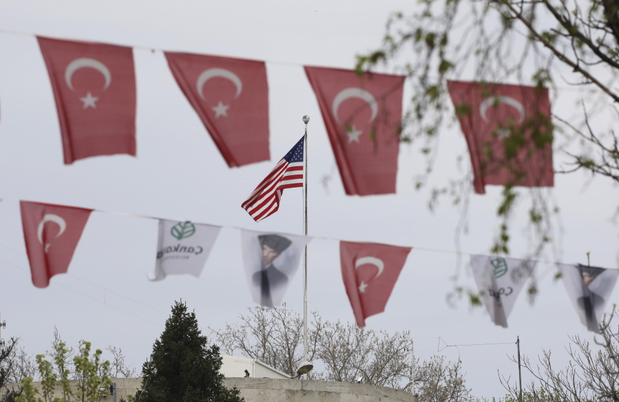 Turkish flags and banners depicting Mustafa Kemal Ataturk, the founder of modern Turkey, decorate a street outside the United States embassy in Ankara, Turkey, Sunday, April 25, 2021. Turkey's foreign ministry has summoned the U.S. Ambassador in Ankara to protest the U.S. decision to mark the deportation and killing of Armenians during the Ottoman Empire as "genocide." On Saturday, U.S. President Joe Biden followed through on a campaign promise to recognize the events that began in 1915 and killed an estimated 1.5 million Ottoman Armenians as genocide.