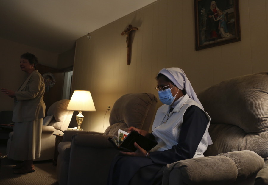 Sister Rose Nellivila sits for morning prayer at St. Anne Home in Greensburg, Pa., where she serves as a nurse for residents of the nursing facility, on Thursday, March 25, 2021. Nellivila contracted the coronavirus last fall and made a full recovery, but a fellow nun, Sister Mary Evelyn Labik, died in October.