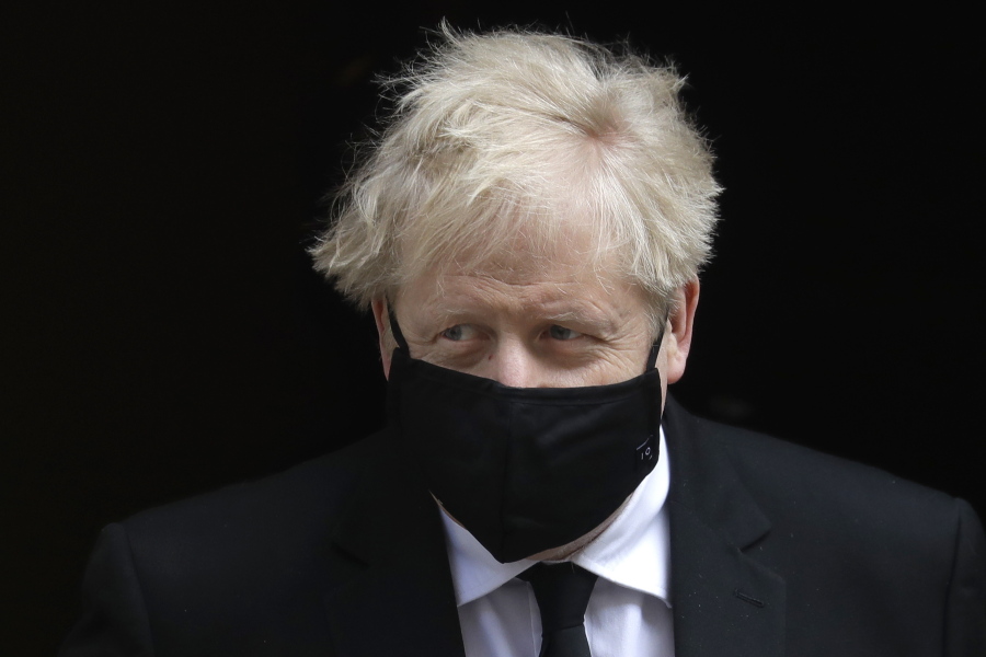 Britain's Prime Minister Boris Johnson leaves 10 Downing Street to attend the weekly session of Prime Ministers Questions in Parliament in London, Wednesday, April 14, 2021.