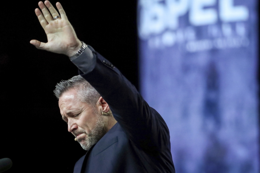 FILE - In this Wednesday, June 12, 2019 file photo, J. D. Greear, president of the Southern Baptist Convention, talks about sexual abuse within the SBC on the second day of the SBC&#039;s annual meeting in Birmingham, Ala. On March 30, 2021, Greear posted a photo on Facebook of him getting the COVID-19 vaccine. It drew more than 1,100 comments - many of them voicing admiration, and many others assailing him.
