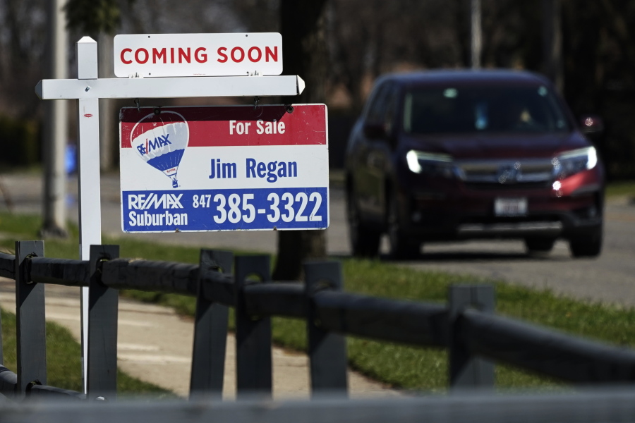 A "for sale" sign stands along side a housing lot in Mount Prospect, Ill., Friday, April 2, 2021. U.S. home prices increased at the fastest pace in seven years in January as the pandemic has fueled demand for single-family houses even as the supply for such homes shrinks. (AP Photo/Nam Y.
