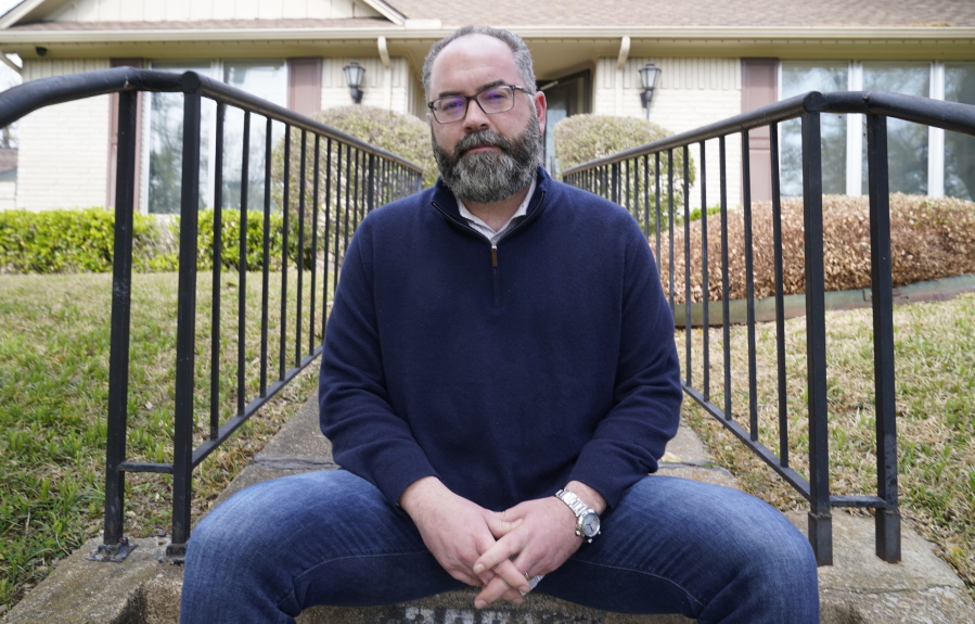 Attorney Mark Melton poses for a photo in front of his home in Dallas, Friday, April 2, 2021. Melton has formed a group made up of volunteer attorneys to help people avoid evictions if they can't pay rent due to the pandemic.