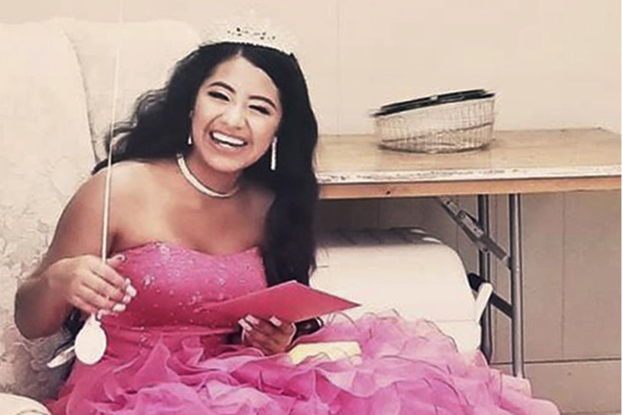 In this February 2021 photo provided by Caring Place@ Miami Rescue Mission, Adriana Palma wears a tiara and ballgown on her quinceanera, her 15th birthday celebration. Quinceaneras are revered in Hispanic culture and celebrated with all the gusto of a wedding.