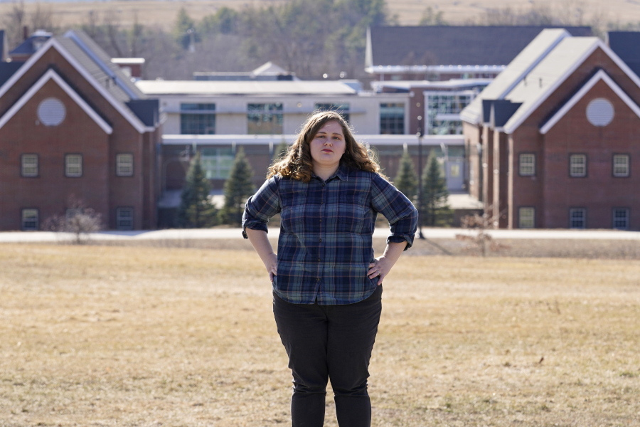 Mary Goddard poses outside the Sununu Youth Development Center, Tuesday, March 23, 2021, in Manchester, N.H. Goddard, a former intern at New Hampshire&#039;s youth detention center says a supervisor suggested she destroy her notes and lie about a teen&#039;s sexual assault allegation.