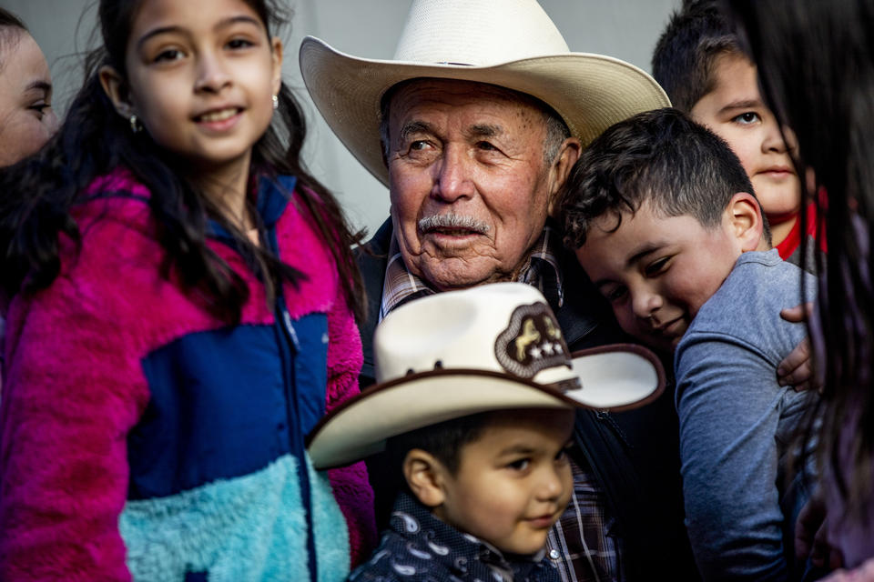 Raul Espinoza Gomez hugs his grandchildren and great-grandchildren during his 78th birthday party in Carnation on April 10, 2021. He was recently vaccinated along with most of his family members.