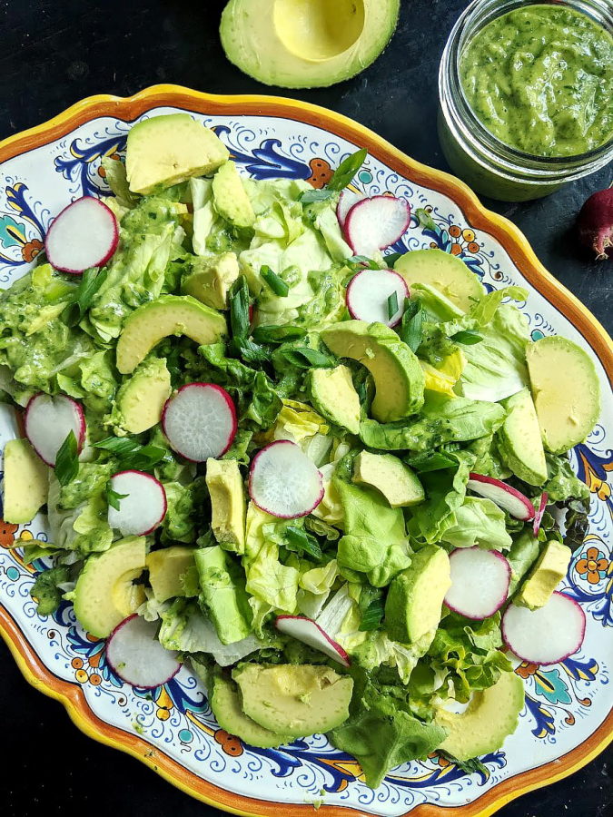Salad with green goddess dressing is heavenly. Green goddess has gone in and out of style over the years, but this fresh, herbal version with creamy avocado, lemon, rice vinegar, and three different soft and leafy herbs is a keeper.