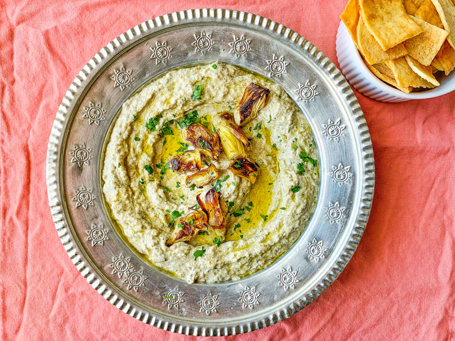 Grilled and marinated artichokes make quick work of this simple dip, enriched with tahini, cumin and lemon juice.