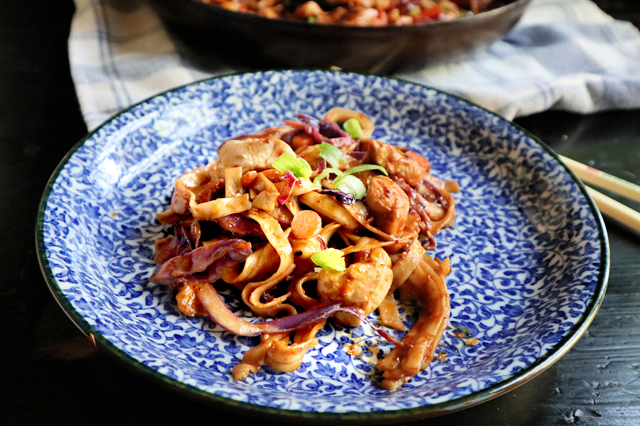 Lo mein noodles tossed in a spicy peanut sauce get an extra boost from tender chunks of chicken.