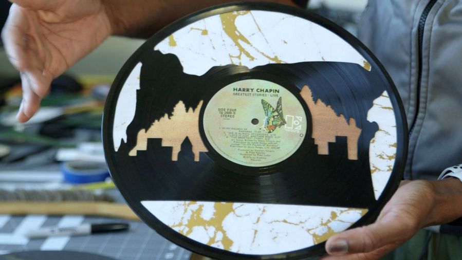 Artist Ty Givens carves old, damaged vinyl records.