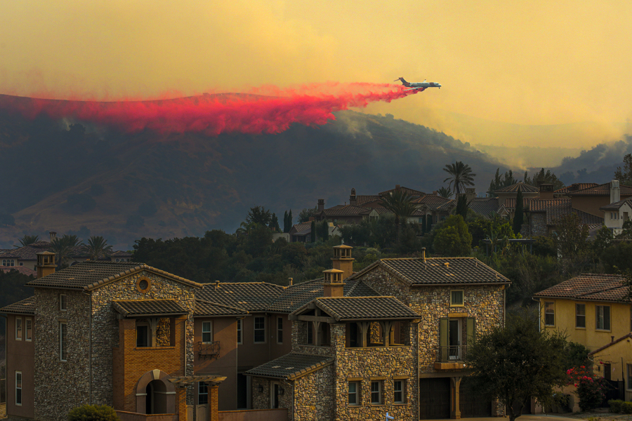An air tanker drops fire retardant during a wildfire in 2020 in Chino Hills, California.