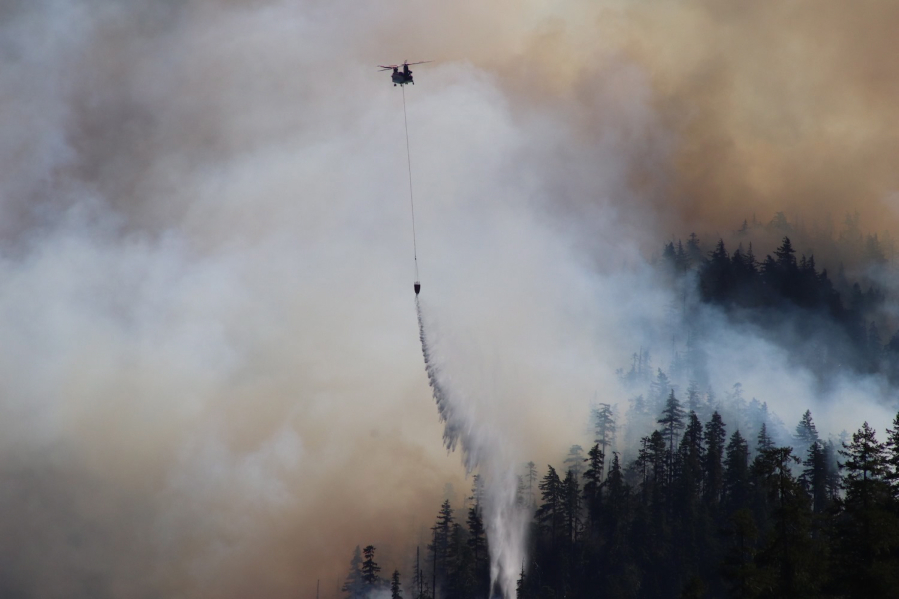 Fire retardant is dropped at Jawbone Flats in the Opal Creek Wilderness in Oregon on Sept. 3, 2020. Drought conditions in the Pacific Northwest are pointing toward another severe fire season this year.