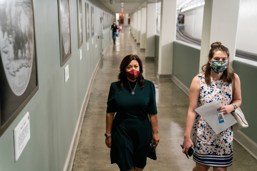 Rep. Norma Torres (D-CA) walks with staffer Leah Carey in the House Office Building Subway to a briefing on Capitol Hill in Washington, D.C., on April 20, 2021.