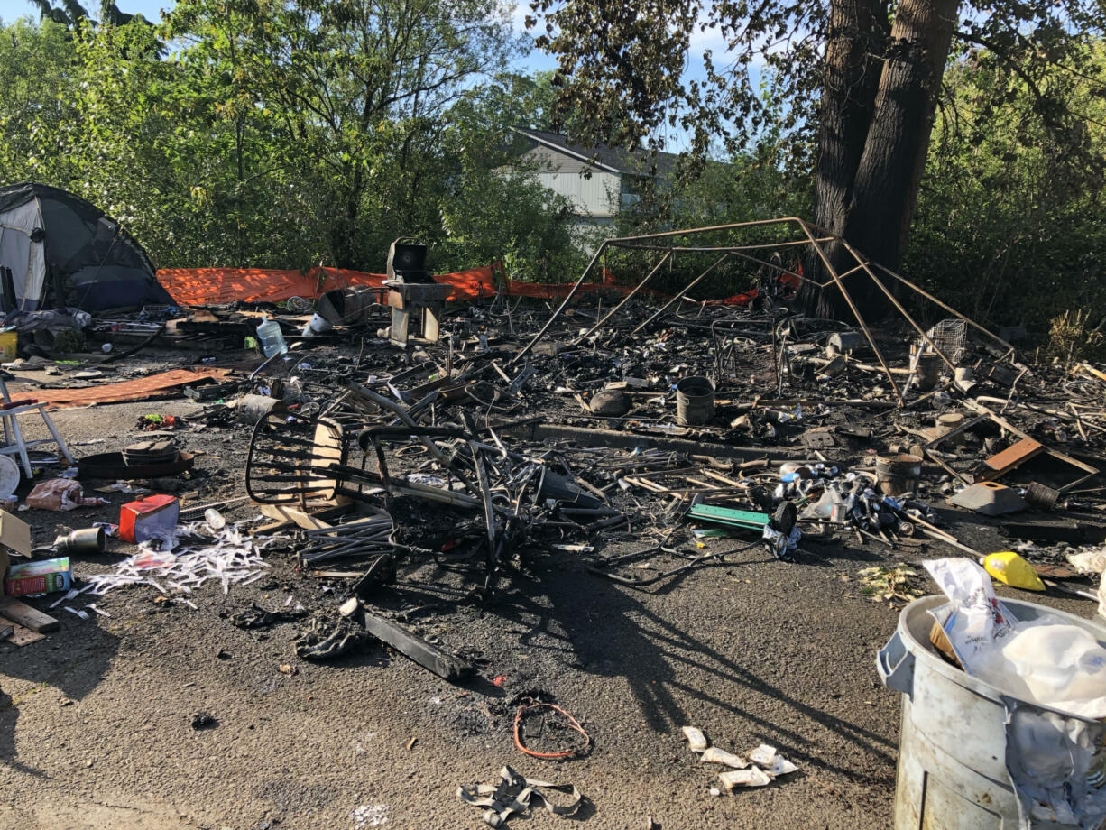 A fire destroyed a tent and other possessions at a homeless camp in east Vancouver early Monday morning.