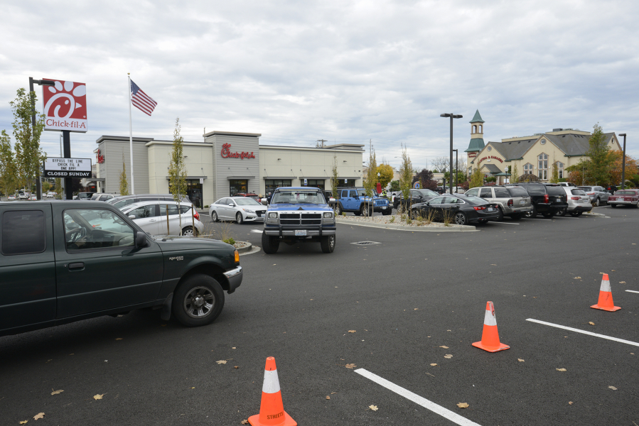 Customers try to find parking in the crowded Chick-fil-A parking lot on Southeast Mill Plain Boulevard in November 2016. The company recently submitted a preliminary application to expand its drive-thru capacity.